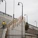 A construction worker walks up the stairs of the nearly completed East Stadium bridge on Tuesday. Daniel Brenner I AnnArbor.com
